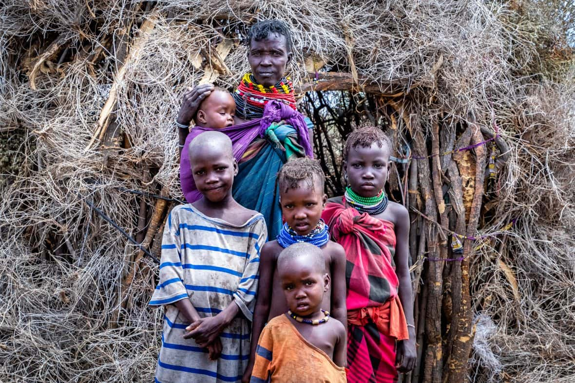 Women standing with children