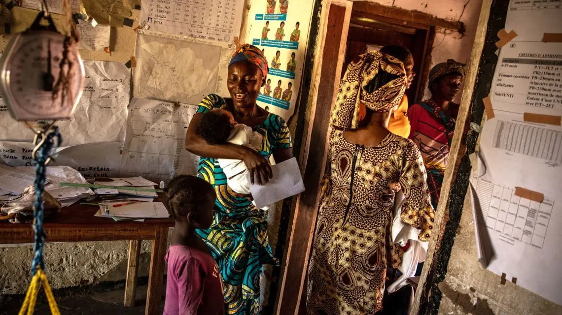 Nurse Leonie Kamono (on left), 37, at Kiambi Heath centre, Manono Territory.