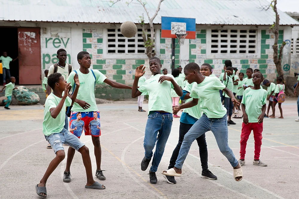 Teenagers playing soccer in Haiti