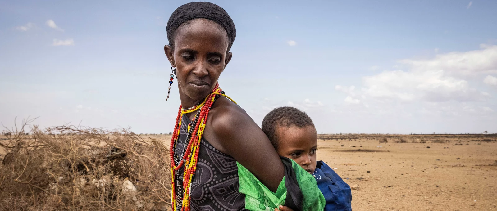 A Kenyan mother carries her child