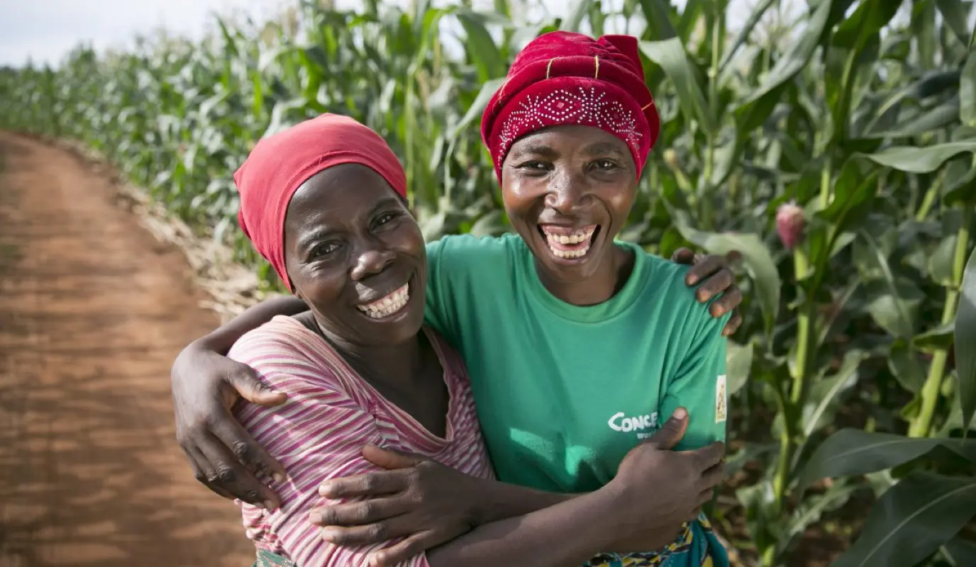 Esime Jenaia, a Lead Farmer for conservation Agriculture, at her plot in Chituke village, Mangochi, Malawi, with neighbor Esnart Kasimu.