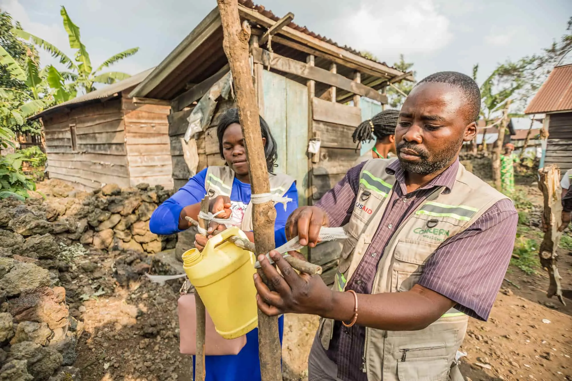 Concern workers setting up equipment for WASH programming