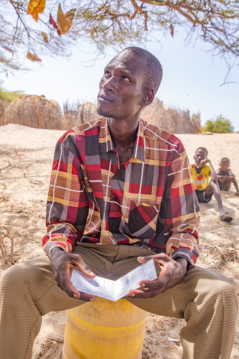 James Nangiro Lokwatuk (31)  has been part of Concern’s livestock treatment e-voucher program for the past two months. The USAID-funded program enables pastoralists to access treatment from a private sector veterinary supplies company at a reduced cost. The idea is to motivate herders to treat their animals routinely, so that they will continue to make it a priority when the program finishes. (Photo: Gavin Douglas/Concern Worldwide)