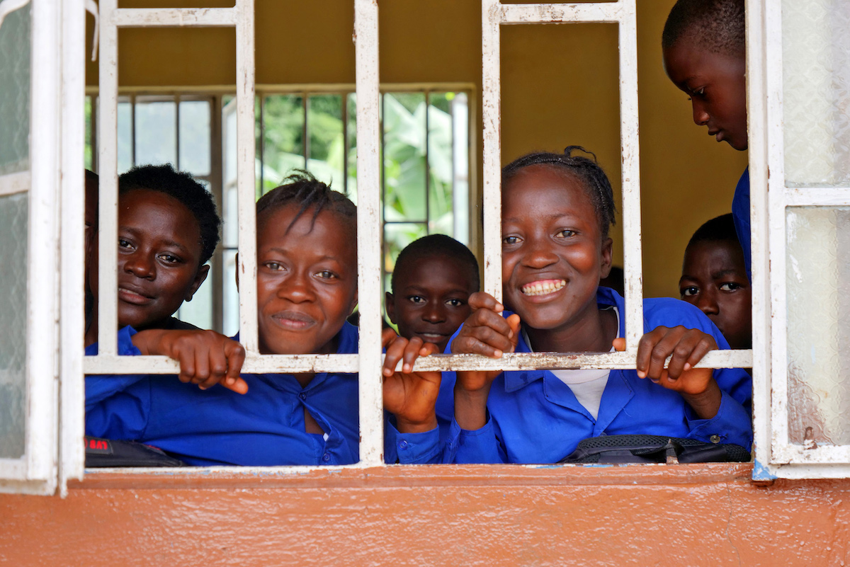 Mariama M Turay (left, 12) and Mary Sesay (12, right) following a class 6 lesson at the Muslim Brotherhood School in Masakong, Sierra Leone. The school participated in an integrated program led by Concern that included the Safe Learning Model to reduce and prevent SRGBV. (Photo: Conor O'Donovan/Concern Worldwide)