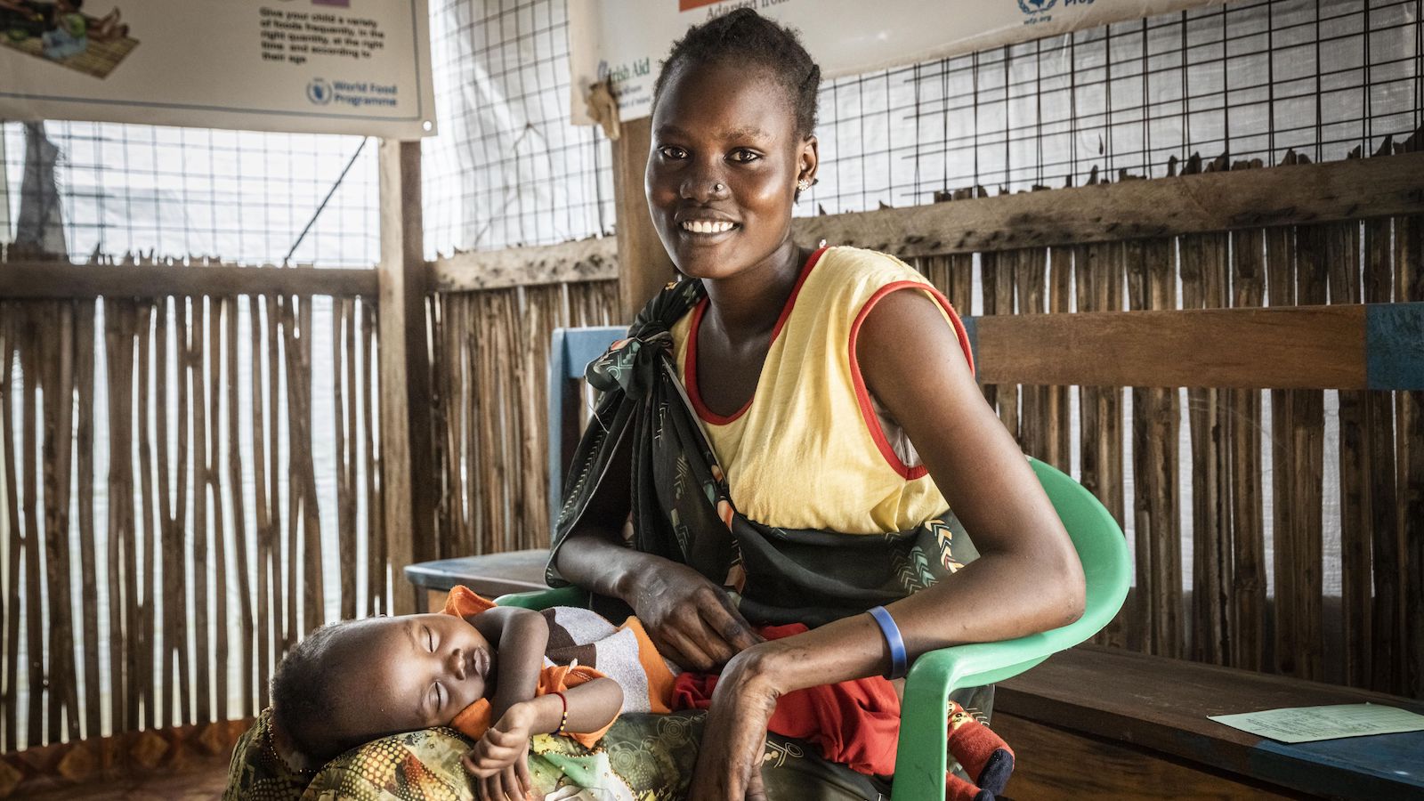 Nyahok Diew is a mother of two children. Her son Teybuom Choap is four years old and her daughter, Nyariek Choap, is 10 months old . Nyahok brought her sick daughter Nyariek to this health care clinic, supported by Concern. (Photo: Ed Ram/Concern Worldwide)