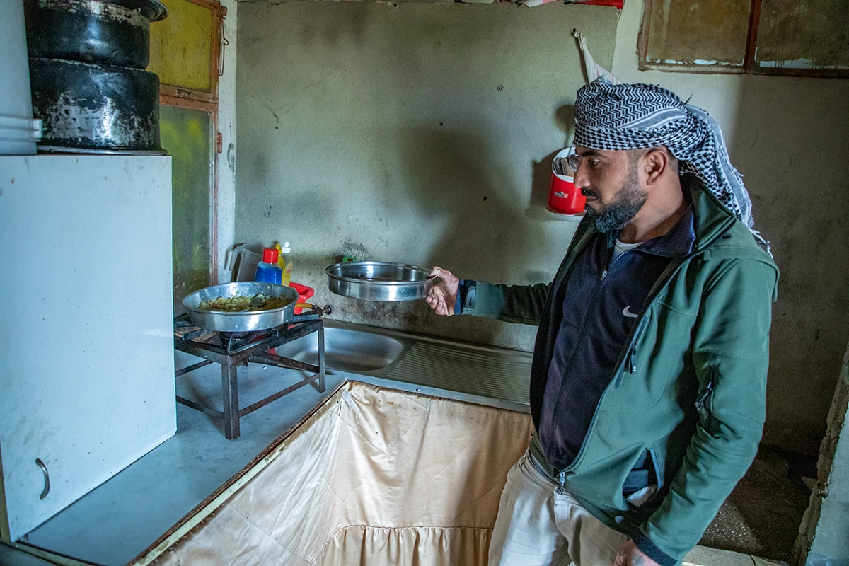 Khaled* in the kitchen area of his family's temporary home in Mt. Lebanon. (Photo: Gavin Douglas/Concern Worldwide)