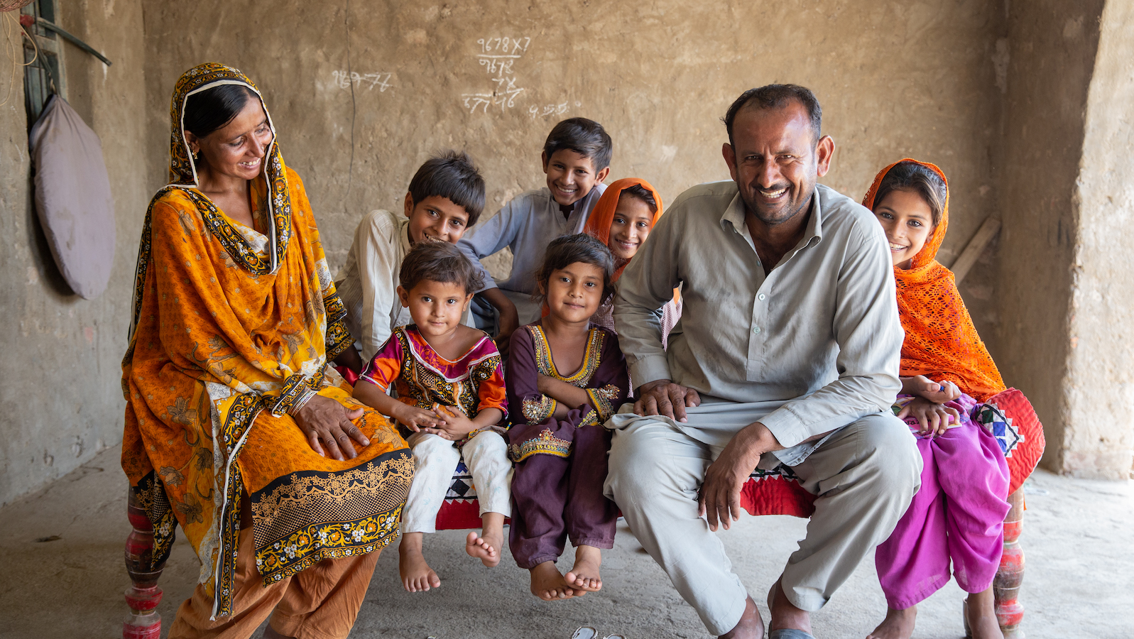 Maula Dinno and his wife and children at their home in Sindh.