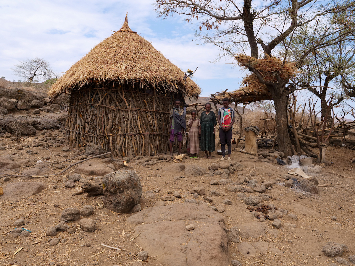 ReGRADE programme participant Abuhay Ejigu and his family infront of their home in Kinfanz. (Photo: Eugene Ikua/Concern Worldwide)