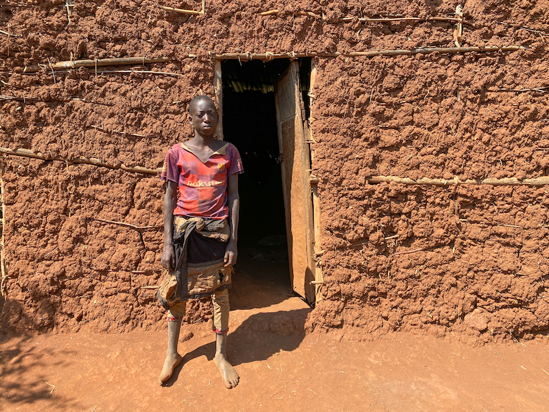 Theogene Niyogisubizo (16) cares for his 12-year-old brother after they were left to live on their own eight years ago. His community is very supportive of him and his brother, and helped them build a house. They also give Theogene regular small jobs to do in exchange for food and money. He plans to use the assistance he receives to send his brother to school. Theogene also wants to buy livestock, which he says he will let his neighbours borrow for manure. (Photo: Eugene Ikua/Concern Worldwide)