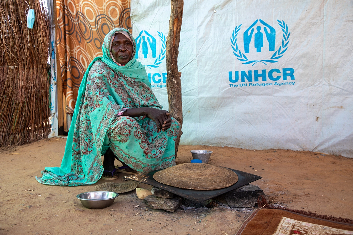 Displaced by the conflcit in Sudan, Fatima* prepares kisra bread, which she sells at her refugee camp in eastern Chad. (Photo: Eugene Ikua/Concern Worldwide)