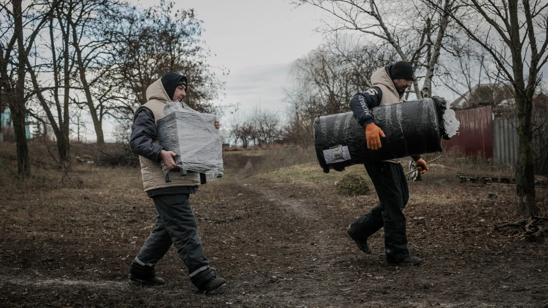 One of Concern’s local partners, We are Brothers, provides stoves and insulates houses in eastern Ukraine. Here, volunteers are preparing to install stoves in local households. (Photo: Simona Supino/Concern Worldwide)