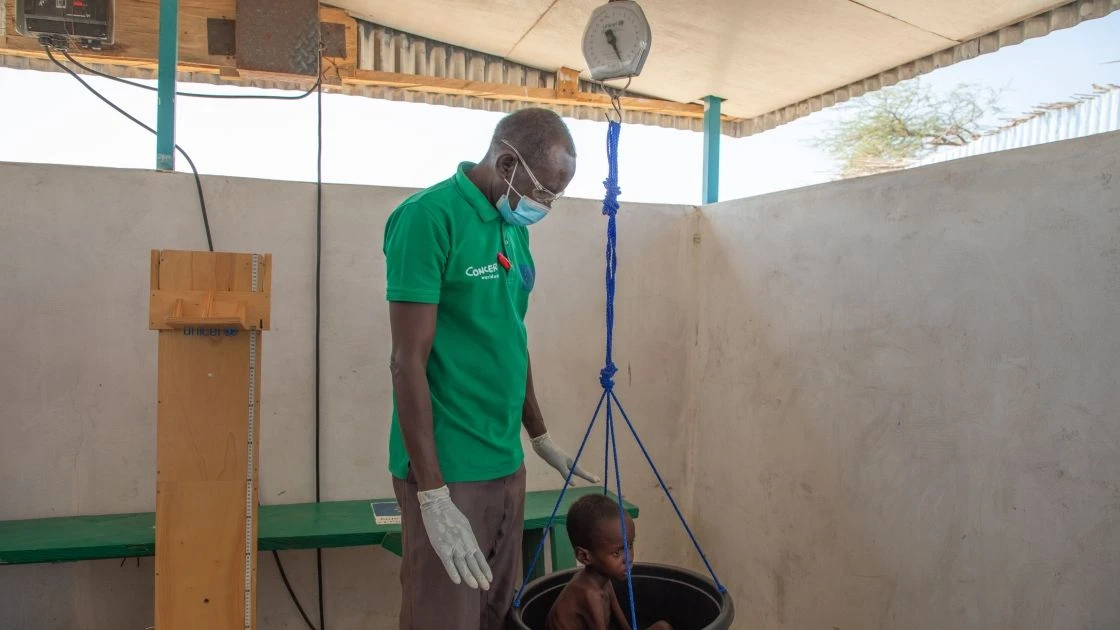 Abdul gets weighed at the Concern health post in Baga Sola, Western Chad. (Photo: Eugene Ikua/Concern Worldwide)