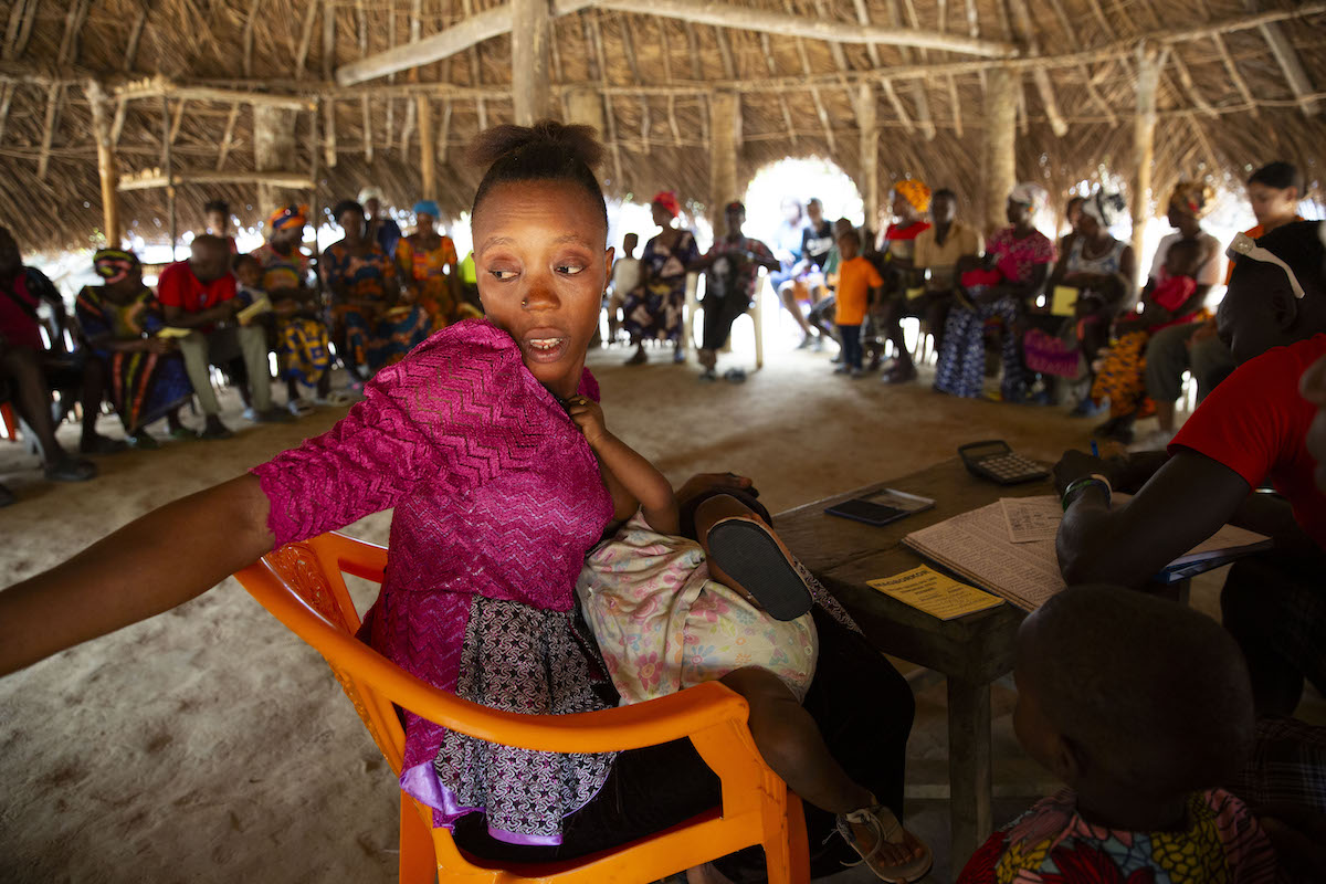 Assanatu combines her roles as mom and secretary of the Village Savings and Loan Association in her home village in Sierra Leone. (Photo: Kieran McConville/Concern Worldwide)