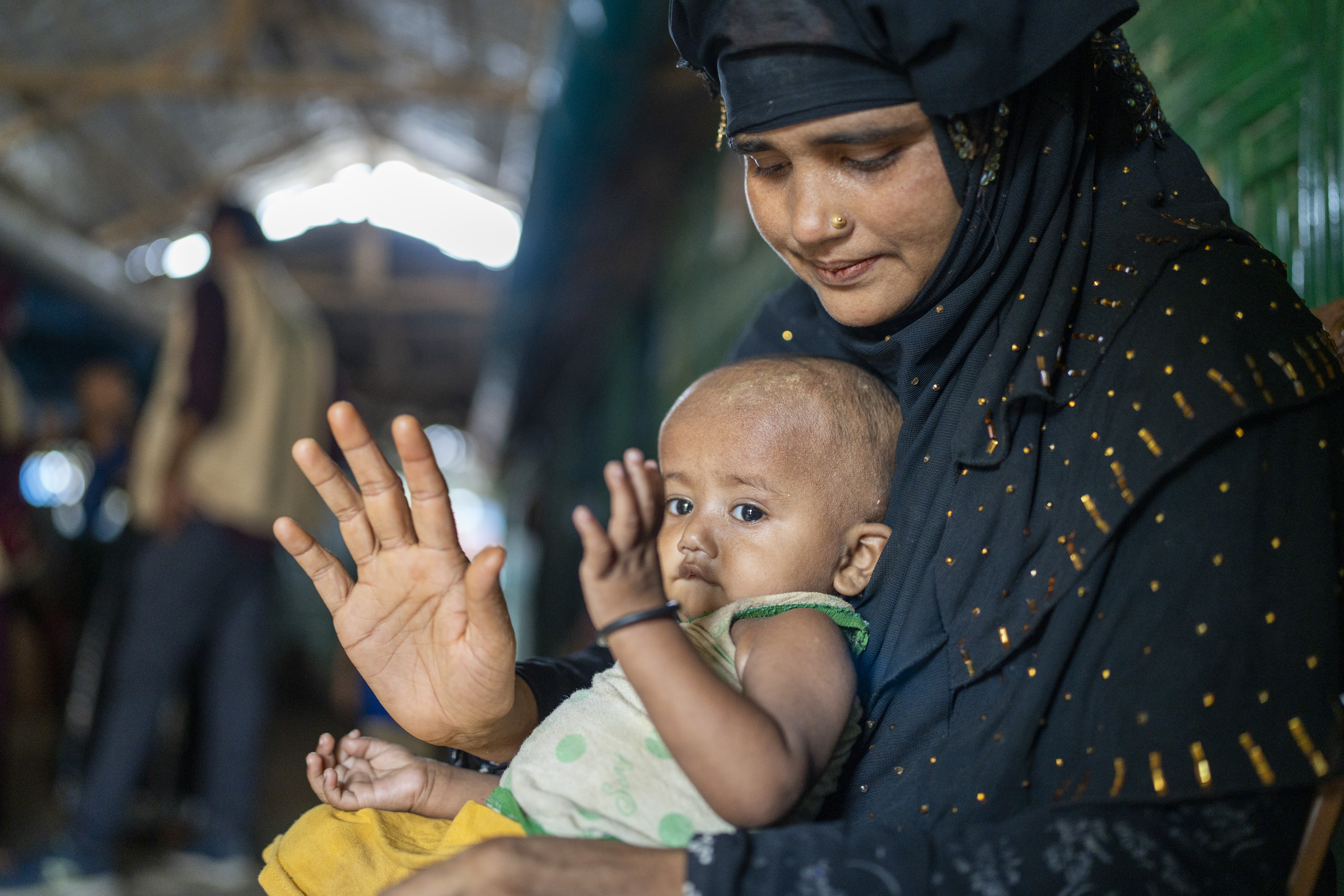 Ayesha* (25) a Rohingya mother visits the Concern nutrition centre with her malnourished son Anwar* (9 months) to receive ready-to-use therapeutic food (RUTF) in the nutrition center at Camp 13, Ukhiya, Cox's Bazar. (Photo: Saikat Mojumder/Concern Worldwide)