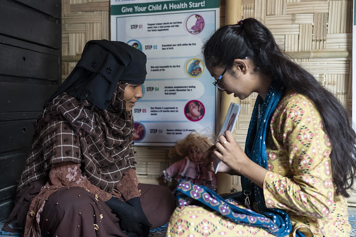 Hasina*, a Rohingya mother-to-be, speaks with a prenatal counselor at Camp 19 in Cox's Bazar. Language barriers can be an issue even in this area of southern Bangladesh, where many assume that the local dialect of Chittagonian is similar enough to Rohingya to be understood. (Photo: Saikat Mojumder/Concern Worldwide)