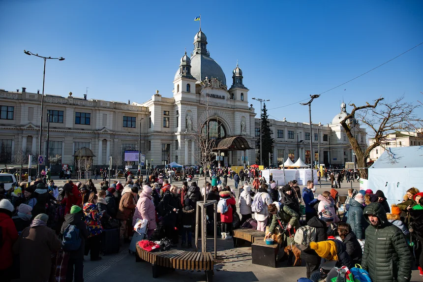 Crowds of people evacuating through the train station at Lviv in Ukraine