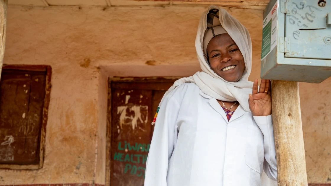 Woman standing outside of health center in Ethiopia