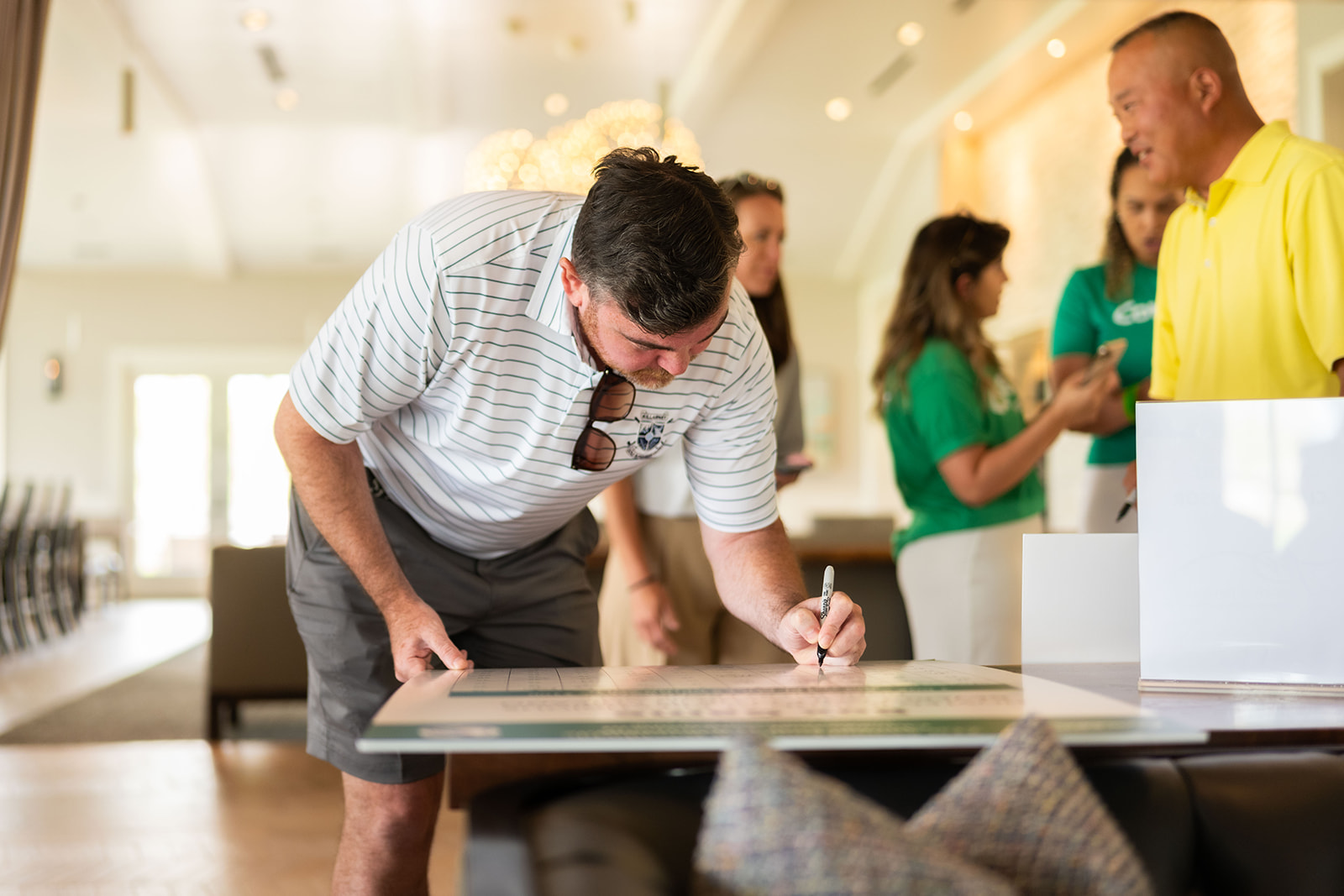 Man signing paper