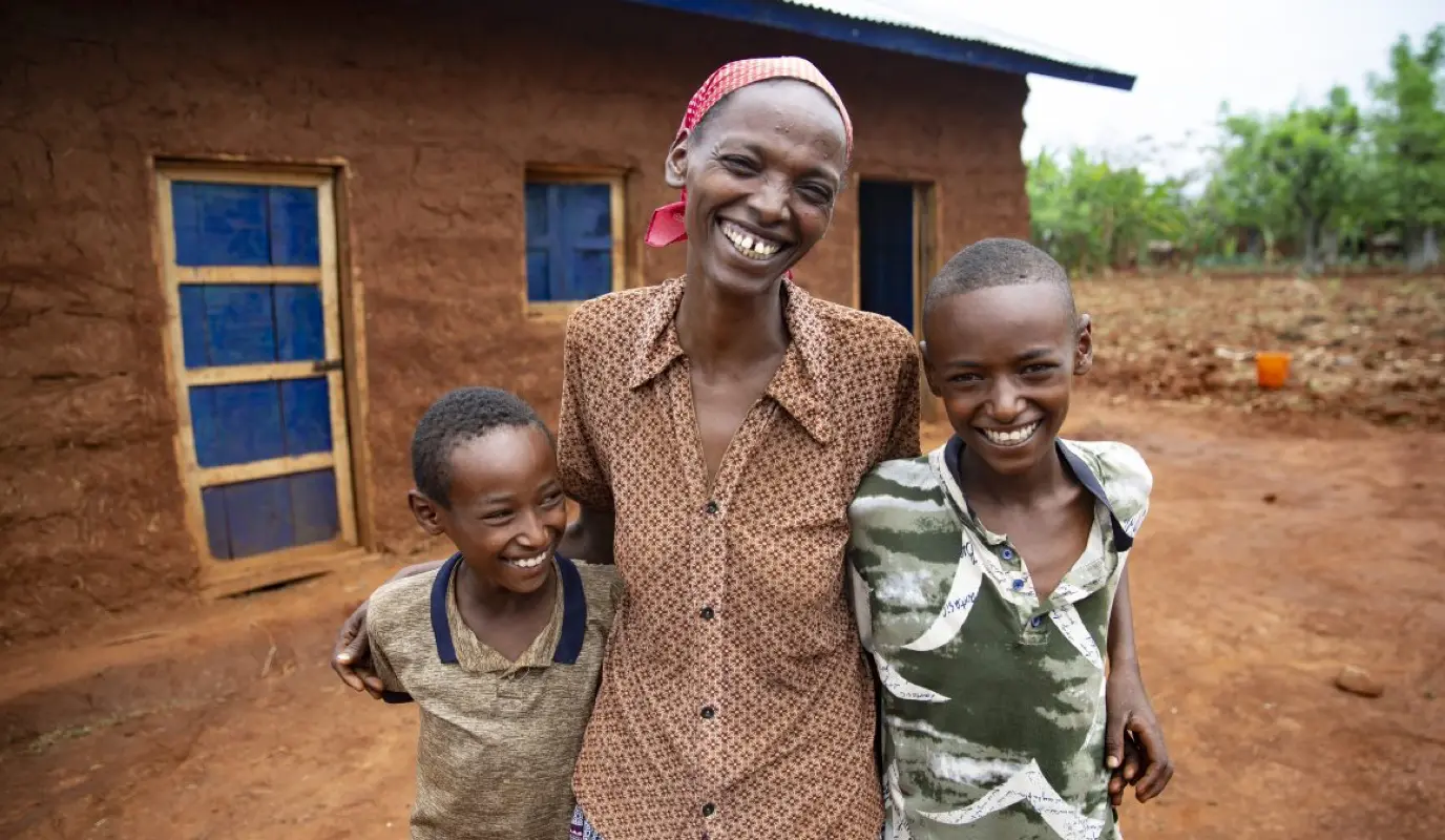 Workinesh Alto with her sons, Assamimow and Abinet standing outside the new family home.