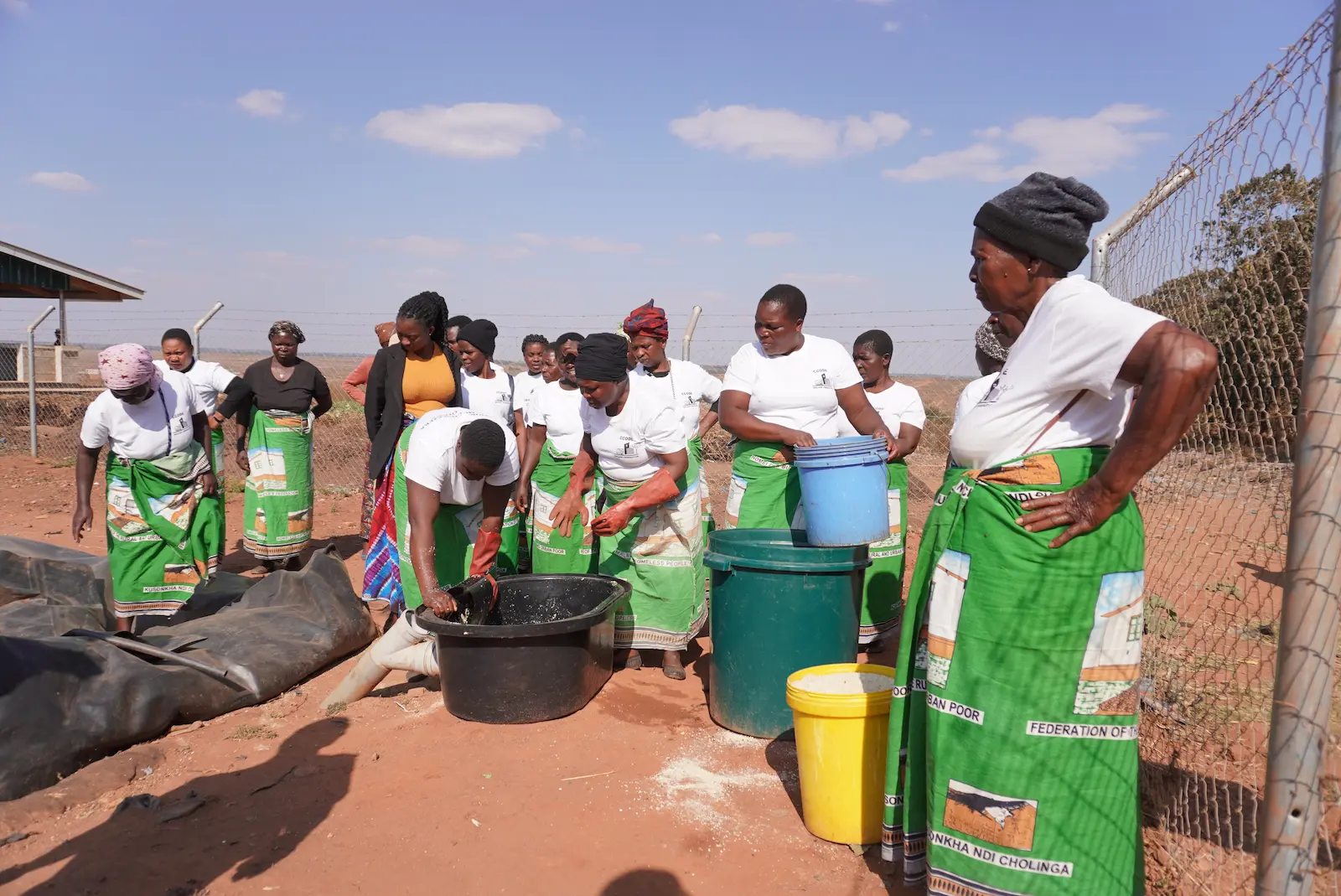 Concern staff holding liquid fertilizer